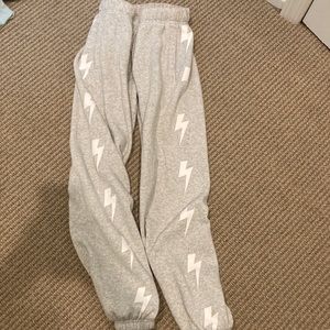 cotton sweatpants with white bolts.